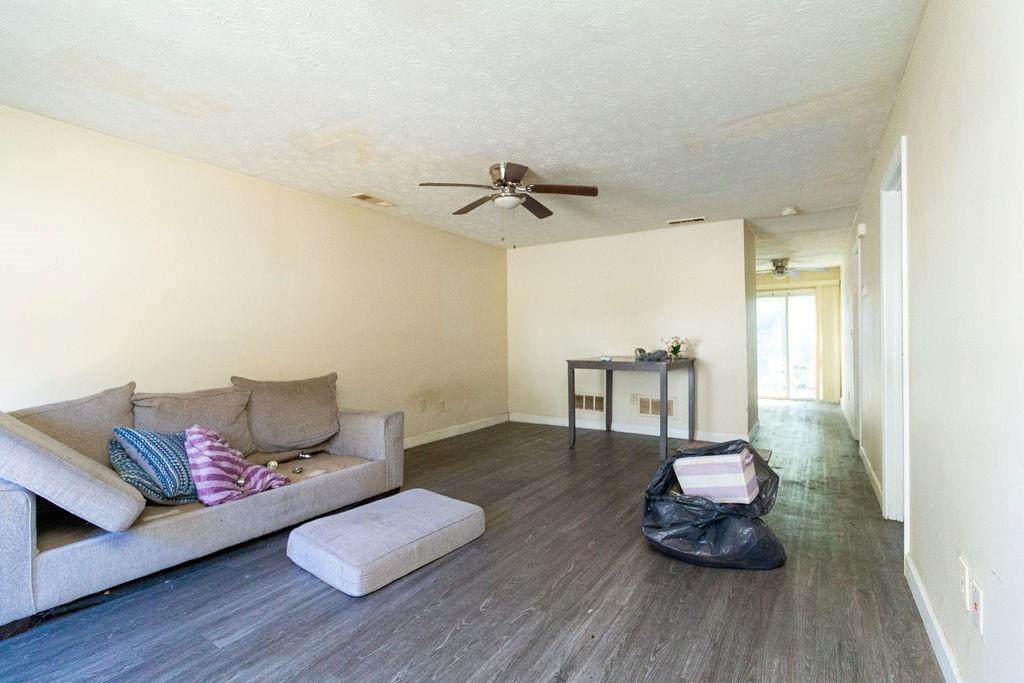 8654 Ashley Way Douglasville, GA 30134 - Photo 2 of 8 a living room with furniture and a wooden floor
