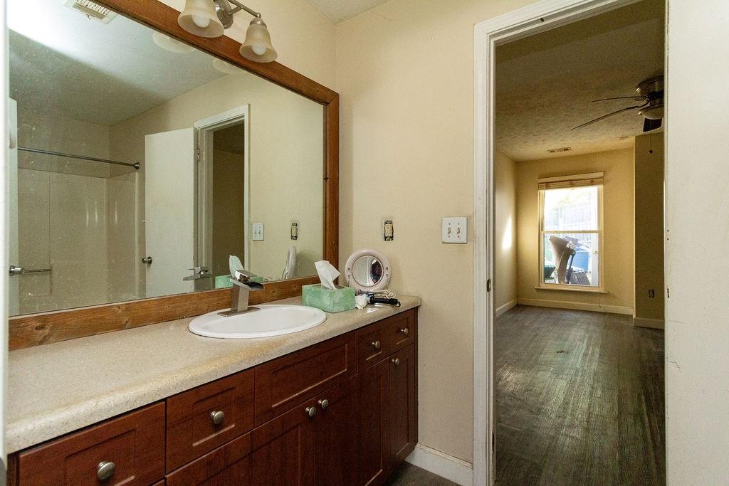 8654 Ashley Way Douglasville, GA 30134 - Photo 6 of 8 a bathroom with a sink and a mirror