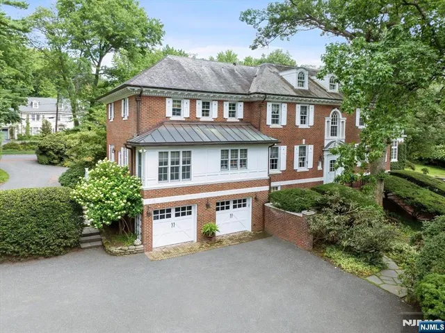front view of a house with a garden