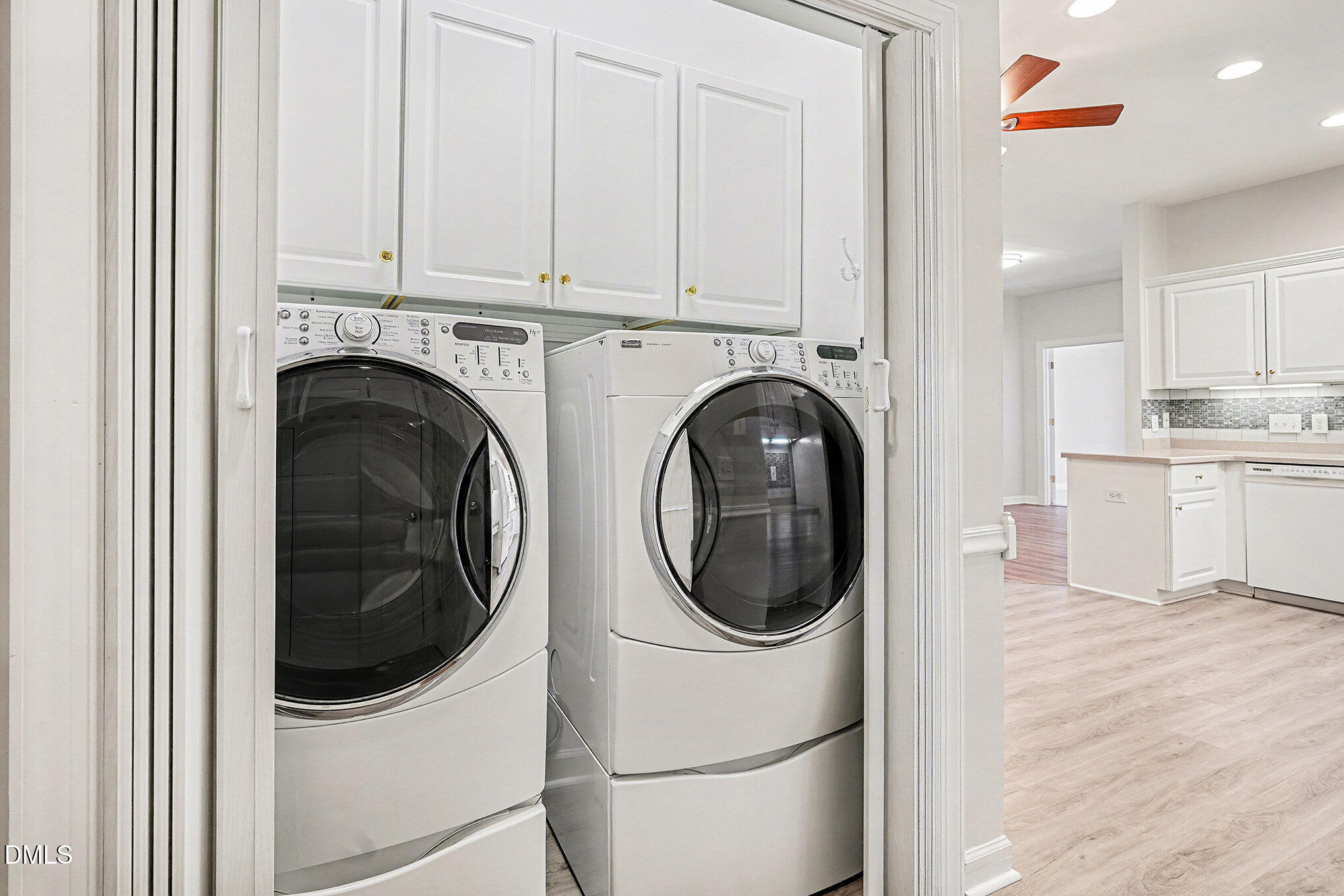 4703 Lewisham Court Raleigh, NC 27612 - Photo 12 of 27 a utility room with dryer and washer