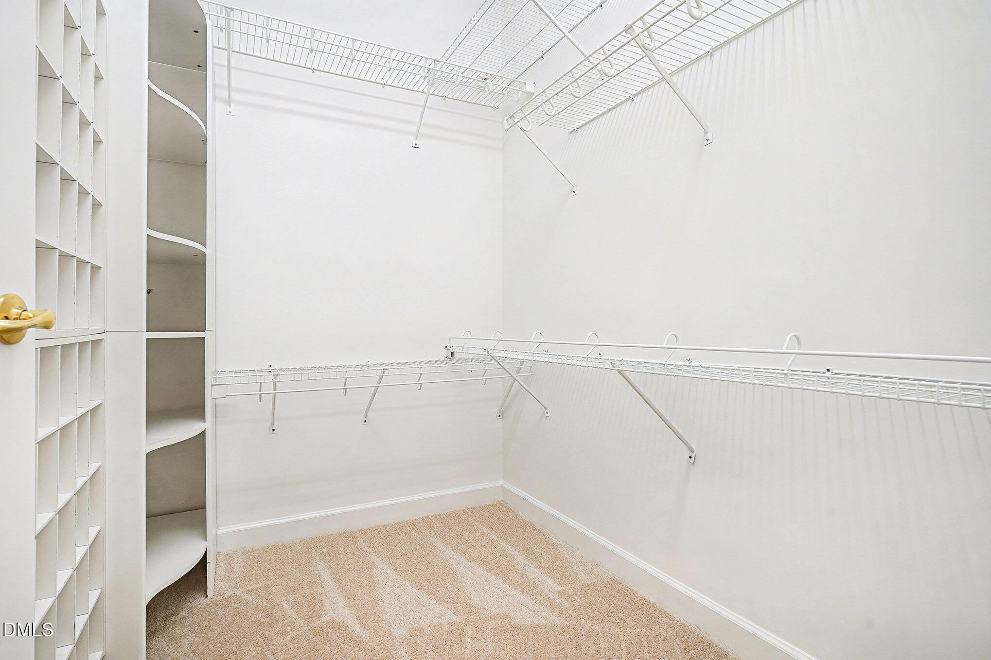 4703 Lewisham Court Raleigh, NC 27612 - Photo 16 of 27 a view of a room with racks on the wall