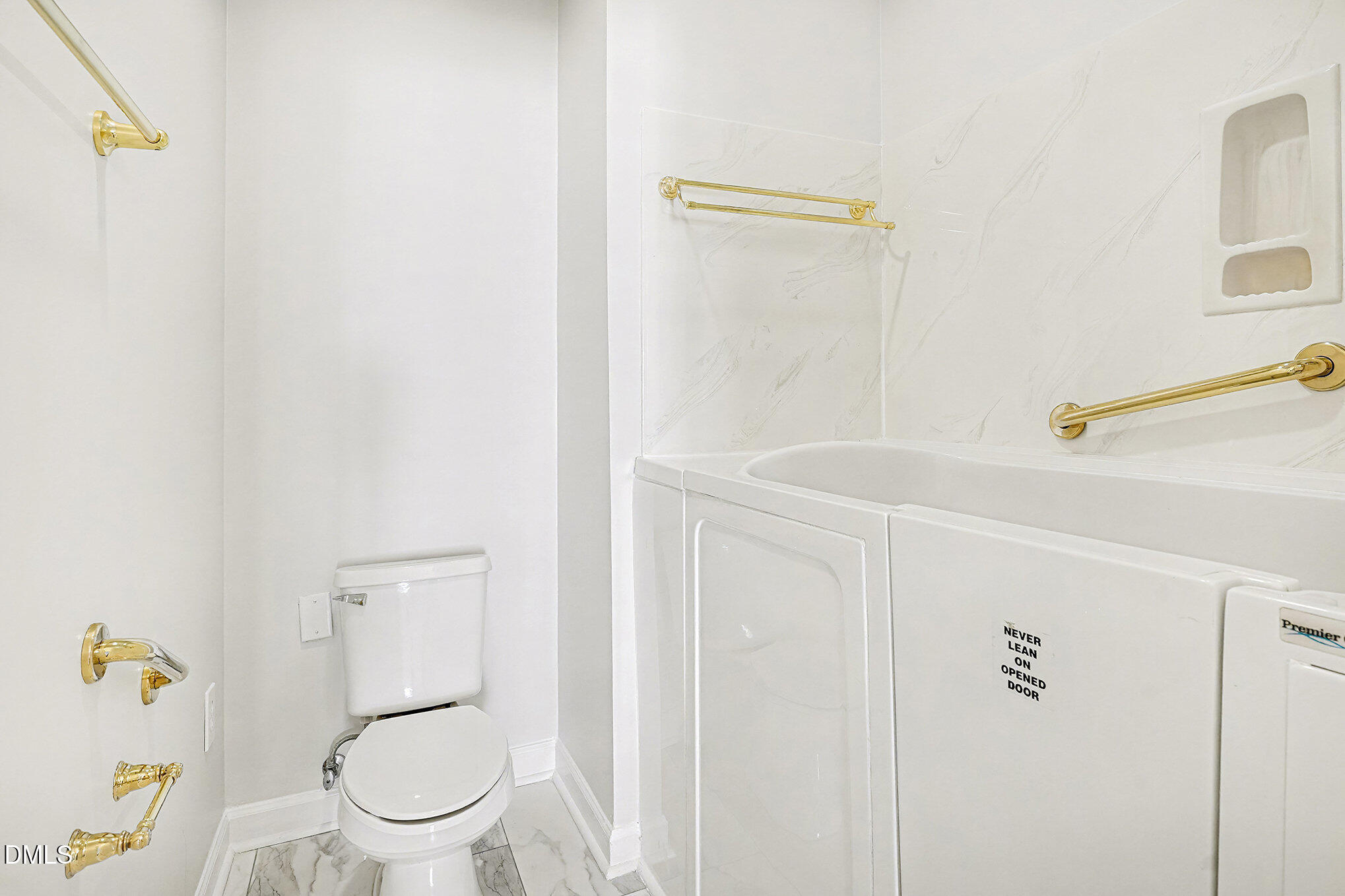 4703 Lewisham Court Raleigh, NC 27612 - Photo 17 of 27 a white toilet sitting next to a bathroom sink