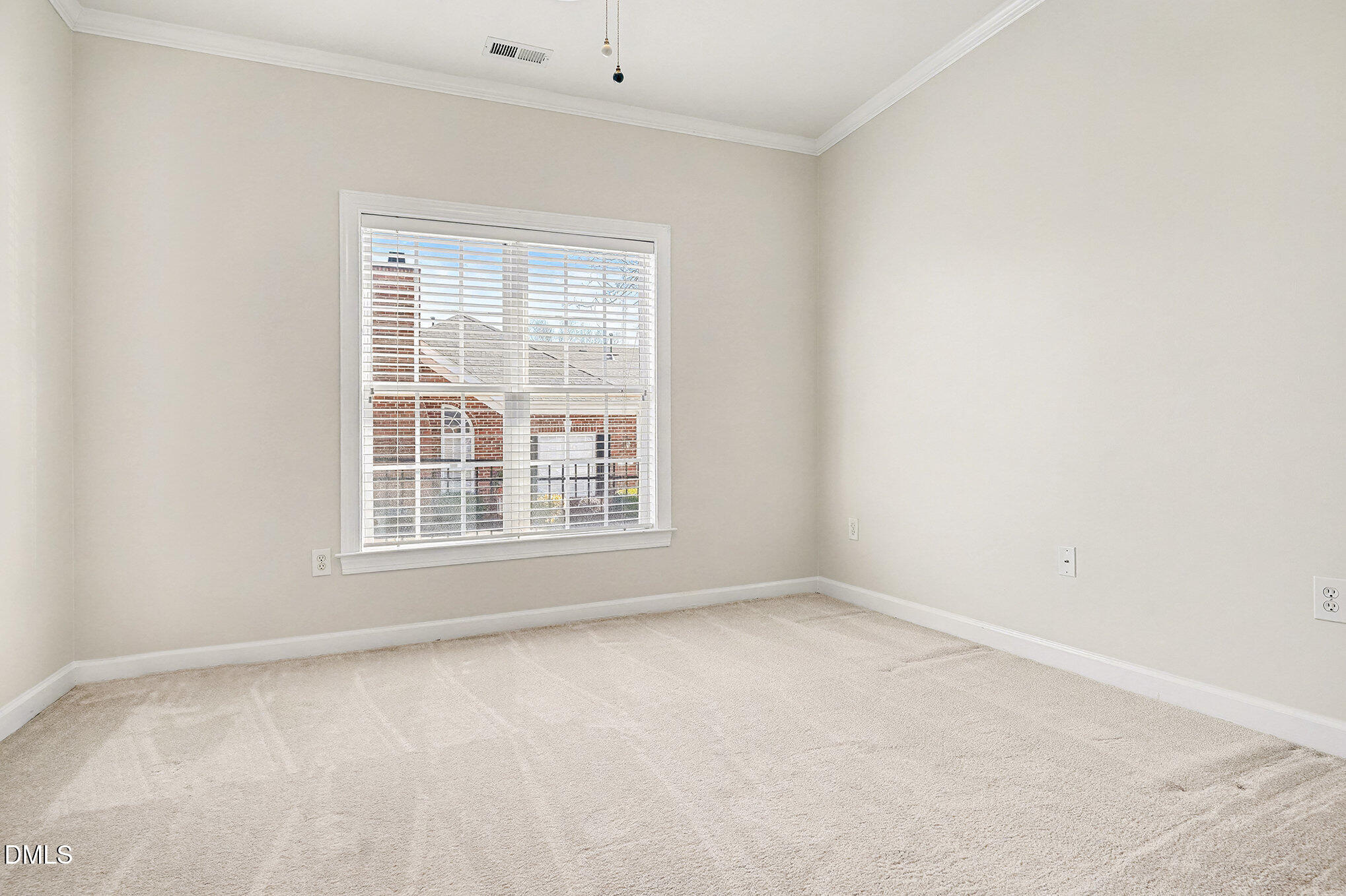 4703 Lewisham Court Raleigh, NC 27612 - Photo 20 of 27 an empty room with a window