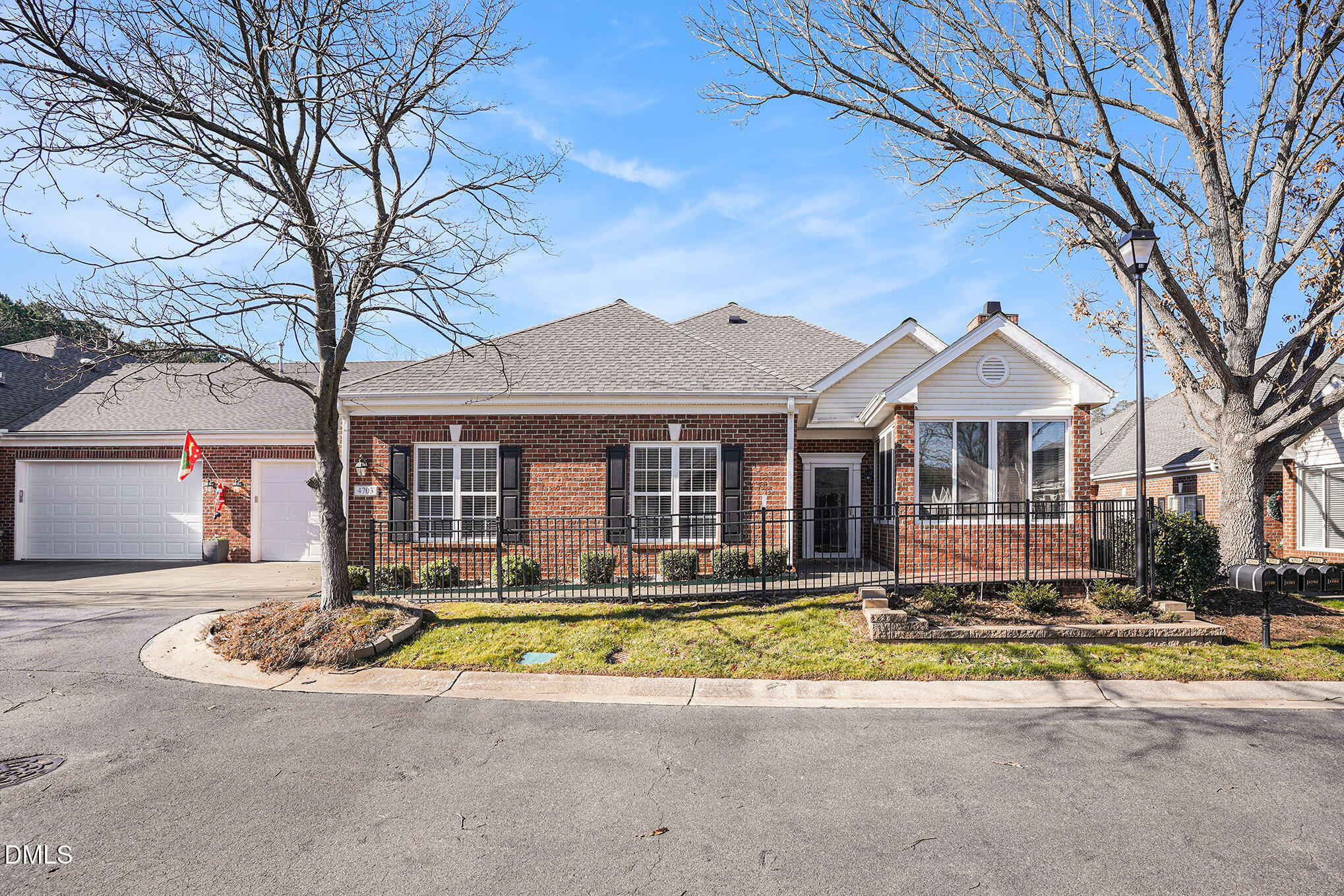 4703 Lewisham Court Raleigh, NC 27612 - Photo 2 of 27 a front view of a house with a yard