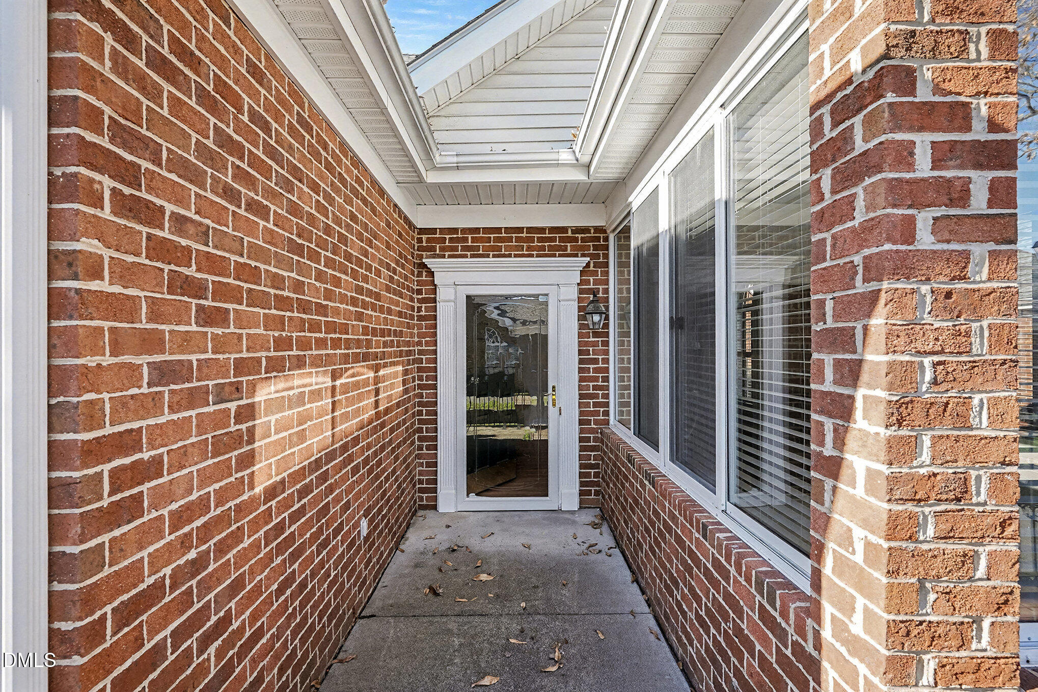 4703 Lewisham Court Raleigh, NC 27612 - Photo 23 of 27 a view of a brick buildings with entryway