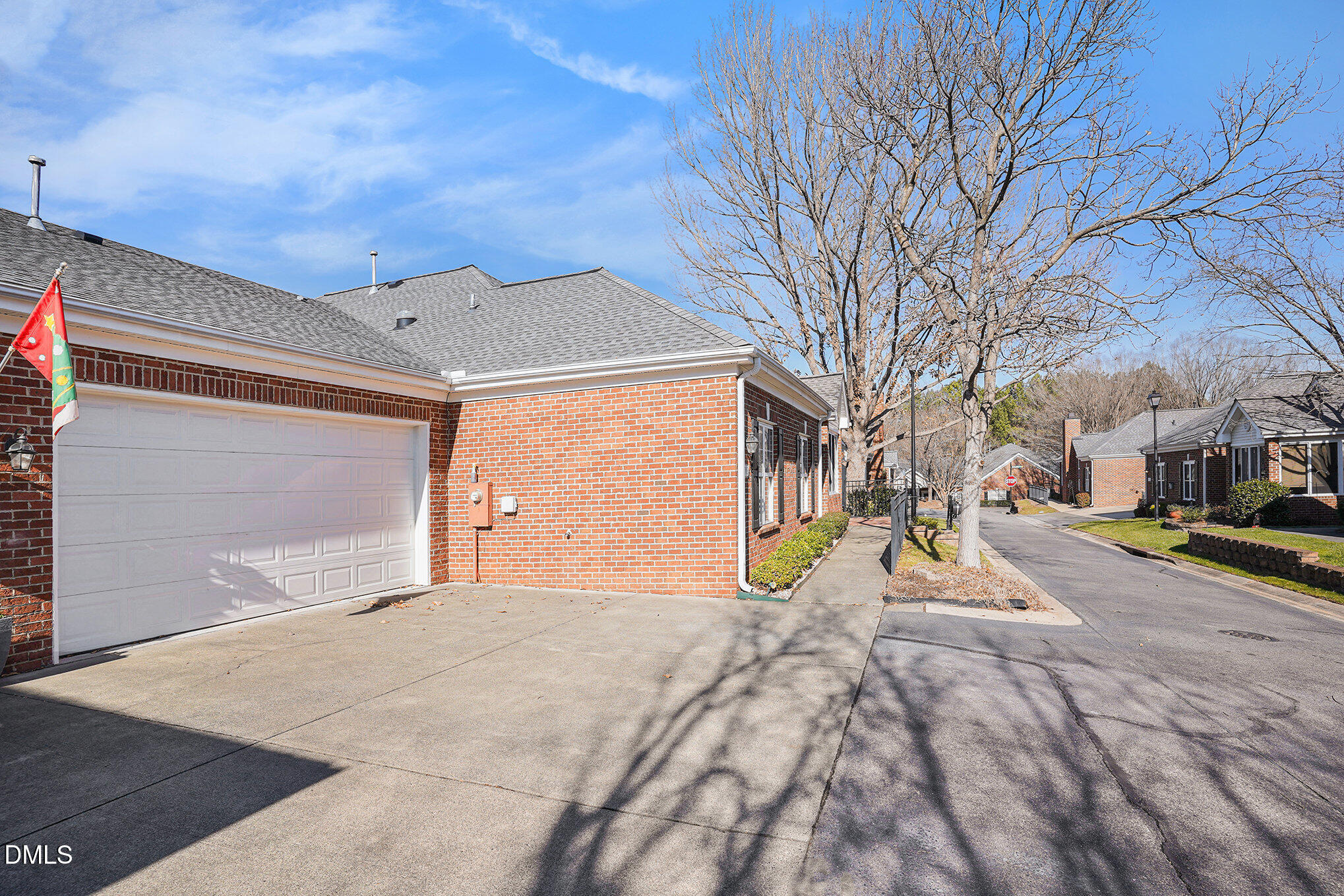 4703 Lewisham Court Raleigh, NC 27612 - Photo 26 of 27 a view of a house with a snow on the road
