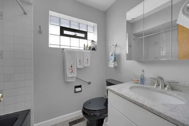 a view of a house with a snow on the road