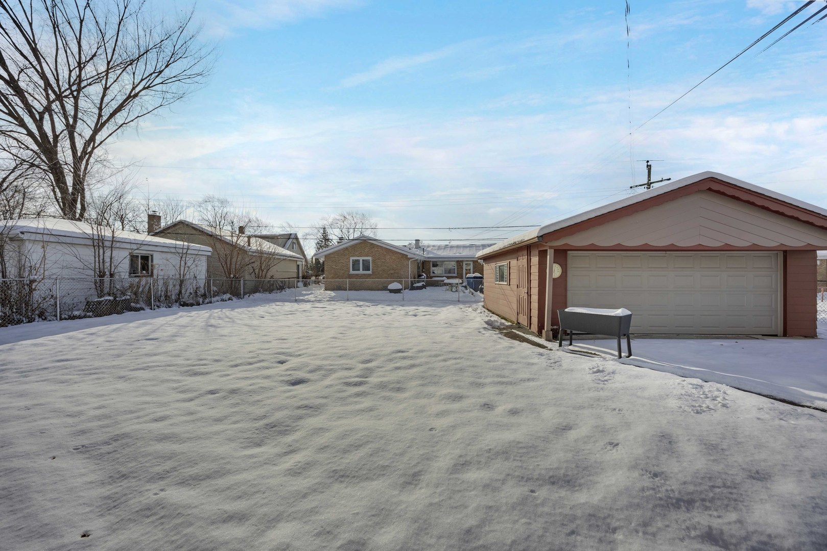 7101 Birch Street Bridgeview, IL 60455 - Photo 17 of 18 a view of a house with wooden fence