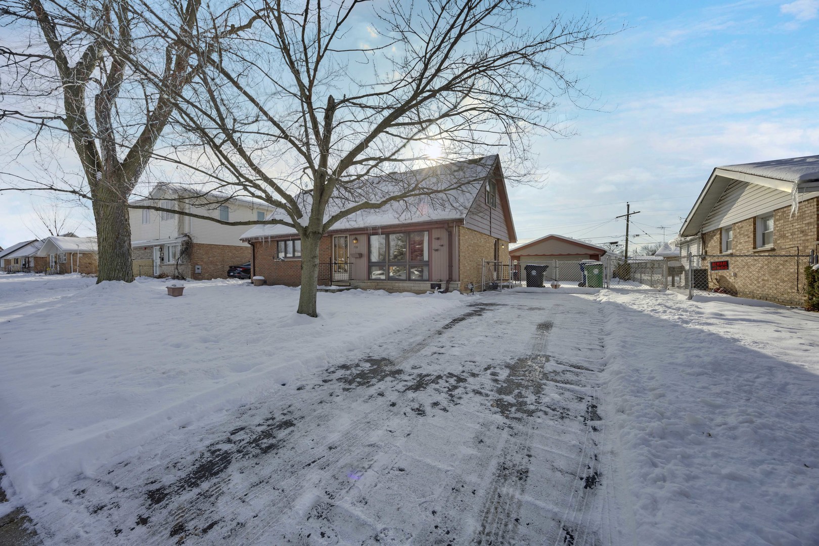 7101 Birch Street Bridgeview, IL 60455 - Photo 18 of 18 a street view covered with snow and trees