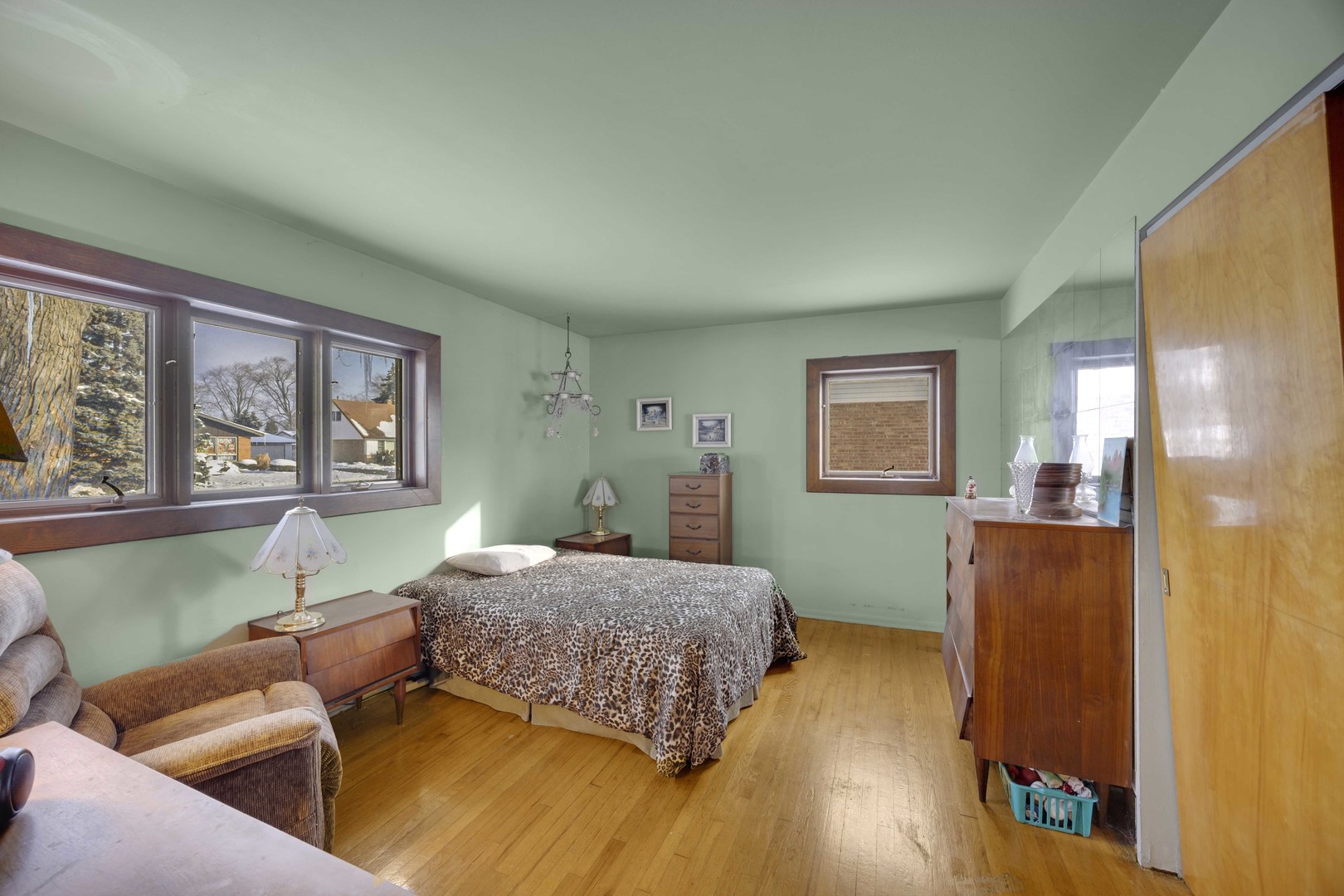 7101 Birch Street Bridgeview, IL 60455 - Photo 4 of 18 a bedroom with a bed and wooden floor