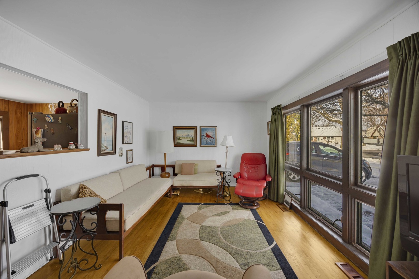 7101 Birch Street Bridgeview, IL 60455 - Photo 8 of 18 a living room with furniture fireplace and a large window