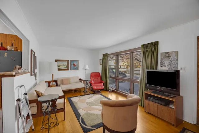 a kitchen with stainless steel appliances granite countertop a refrigerator a sink a stove and island