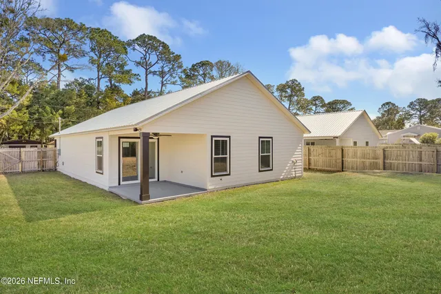 a view of a backyard of the house