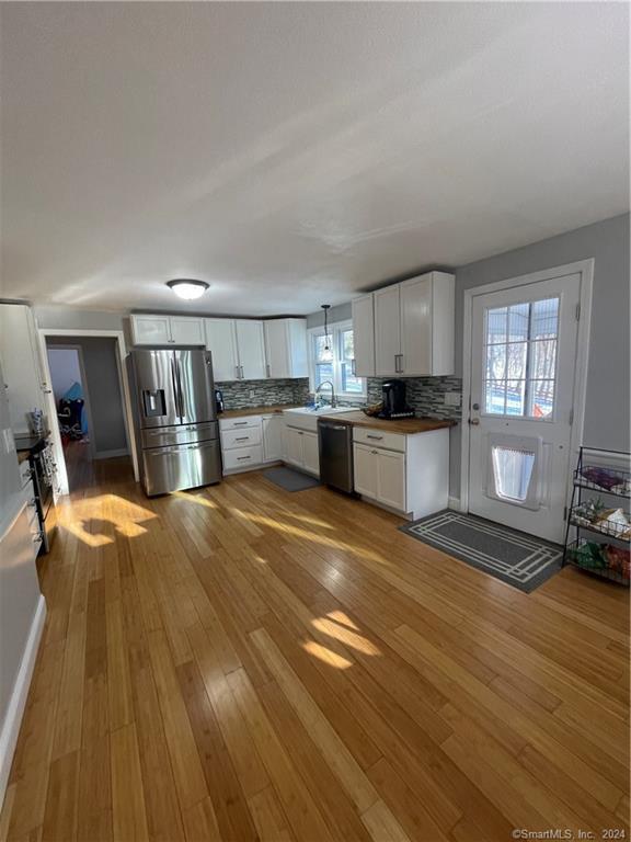 Get ready to be WOW'd with this RARELY AVAILABLE renovated 4 Bedroom, 2 Full Bathroom Single Family Home with attached Garage in highly sought after Portland!