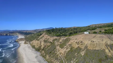a view of a road with mountains in the background