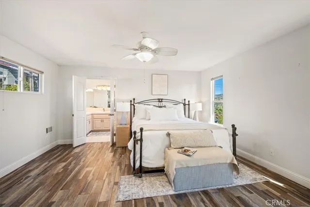 a bathroom with a sink vanity granite and a mirror