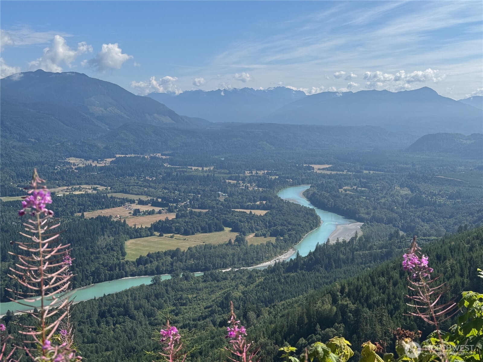 a view of a town with mountains in the background