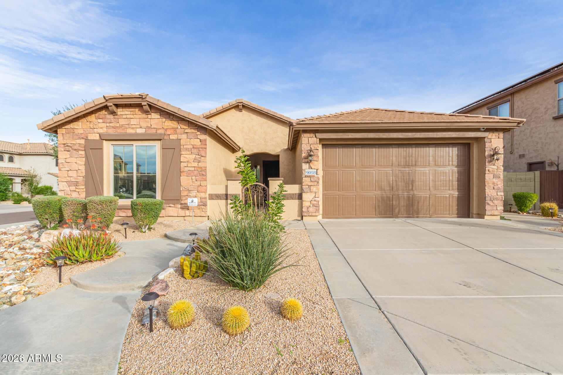 9058 West Redbird Road Peoria, AZ 85383 - Photo 1 of 39 a view of backyard of the house