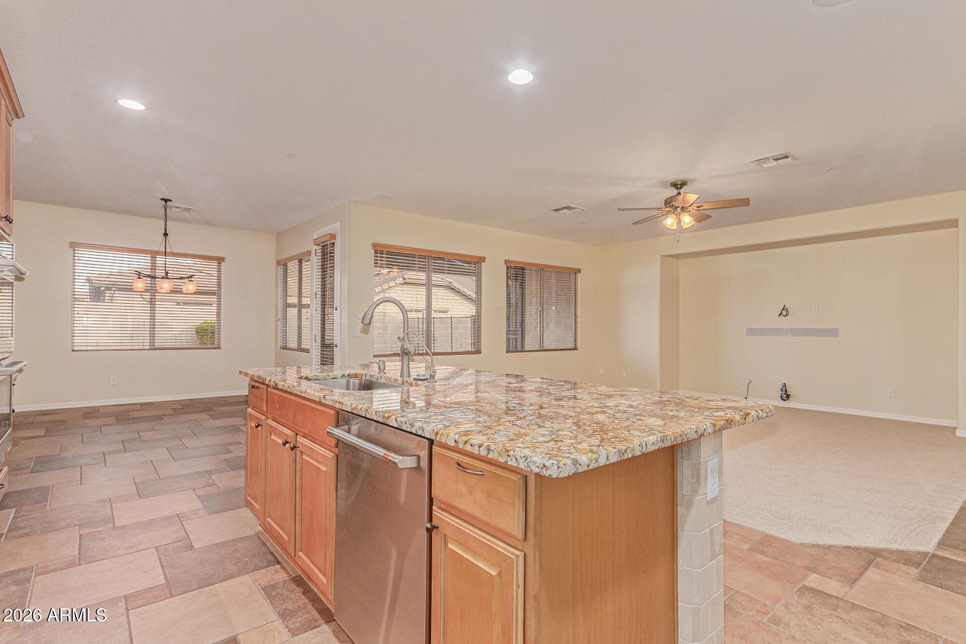 9058 West Redbird Road Peoria, AZ 85383 - Photo 13 of 39 a view of kitchen with center island and windows