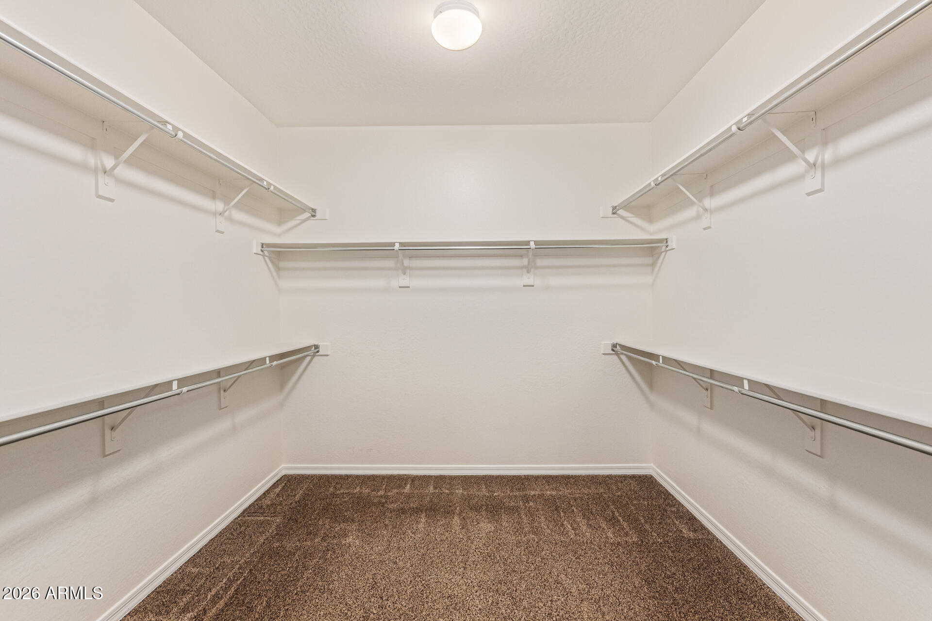 9058 West Redbird Road Peoria, AZ 85383 - Photo 19 of 39 a view of a room with racks on the wall