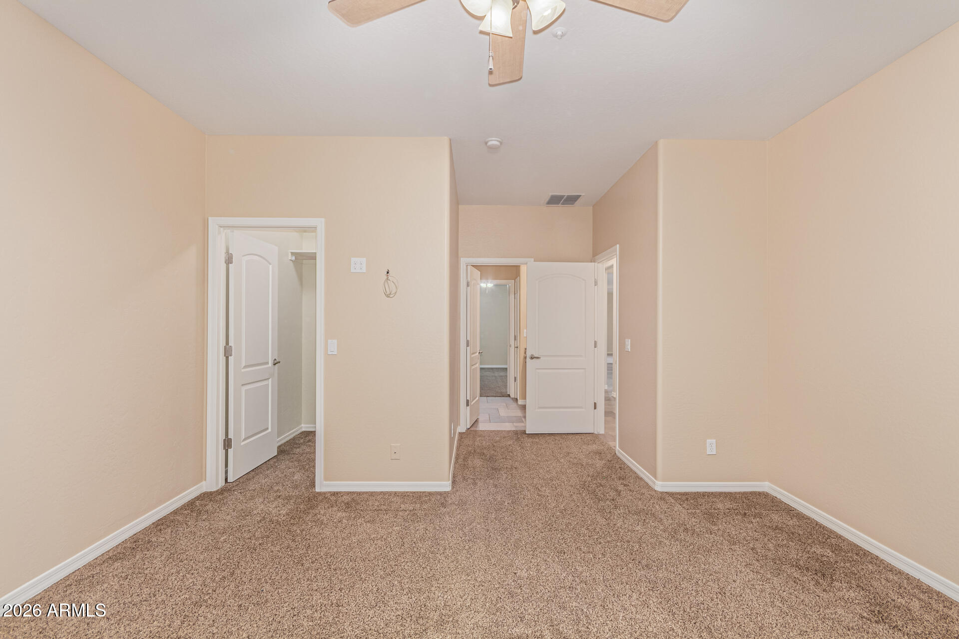 9058 West Redbird Road Peoria, AZ 85383 - Photo 21 of 39 an empty room with a bathroom