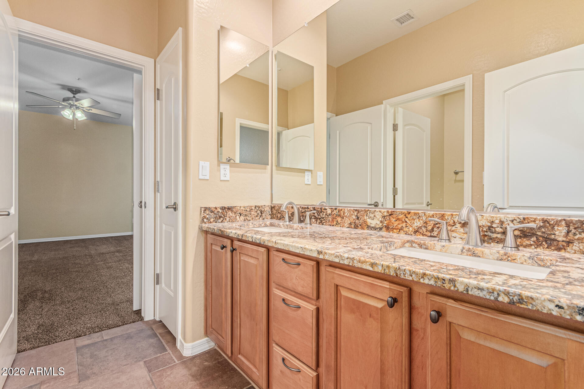 9058 West Redbird Road Peoria, AZ 85383 - Photo 23 of 39 a bathroom with a granite countertop sink and a mirror