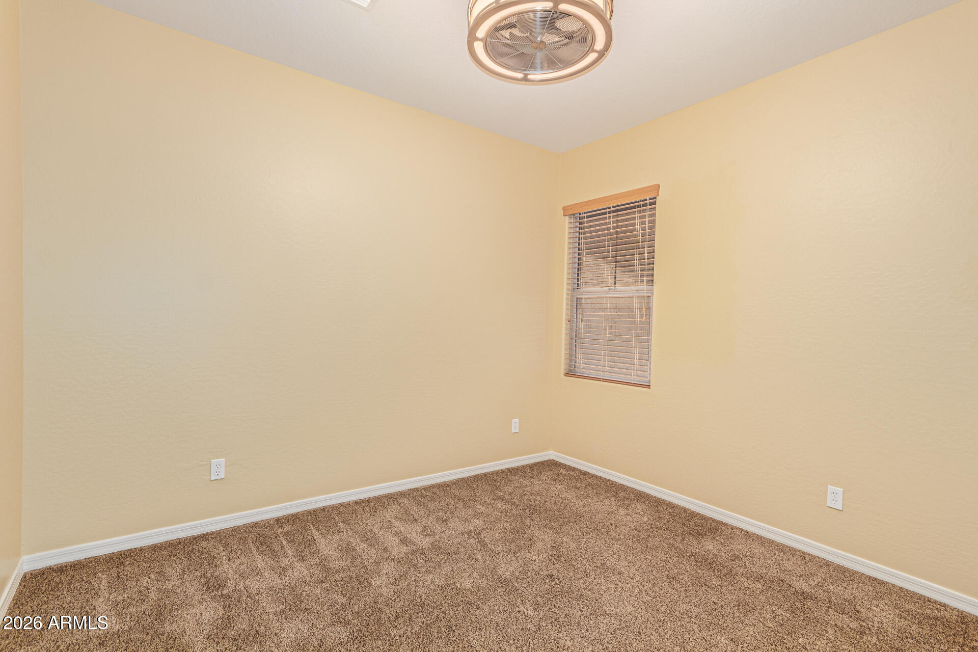 9058 West Redbird Road Peoria, AZ 85383 - Photo 29 of 39 an empty room with a window