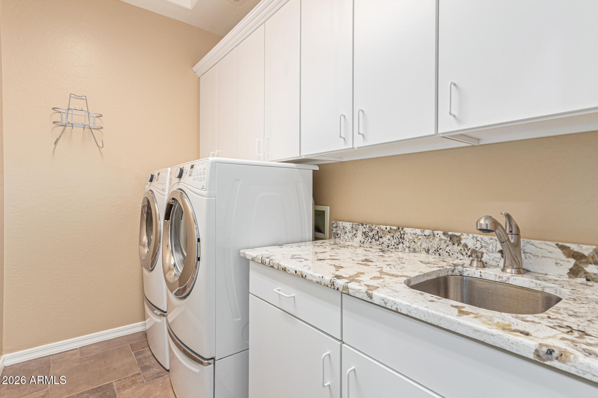 9058 West Redbird Road Peoria, AZ 85383 - Photo 31 of 39 a utility room with dryer and washer