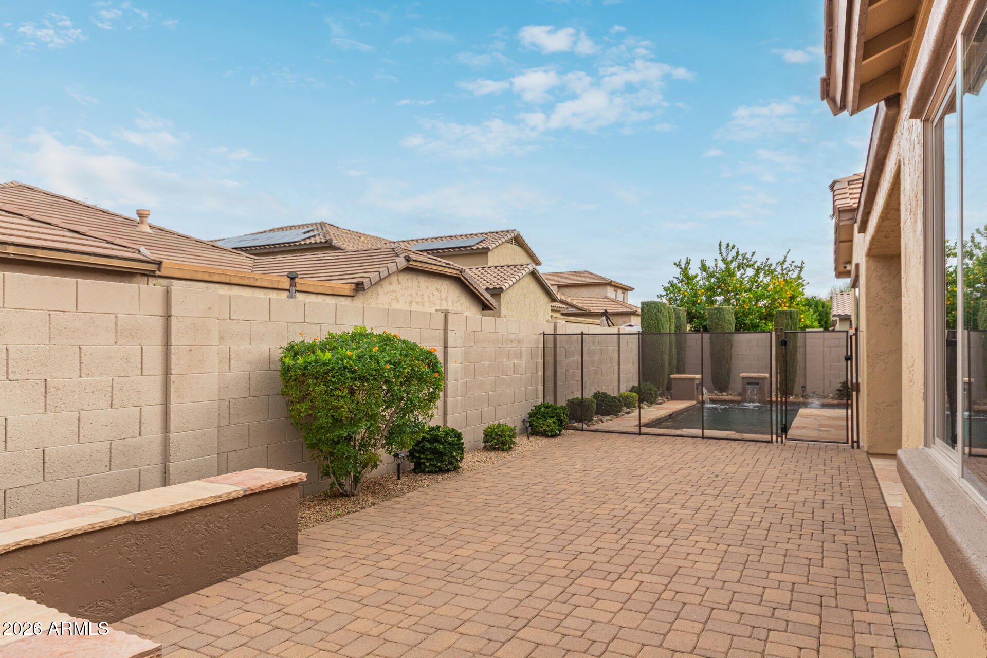 9058 West Redbird Road Peoria, AZ 85383 - Photo 33 of 39 a view of a house with backyard and sitting area