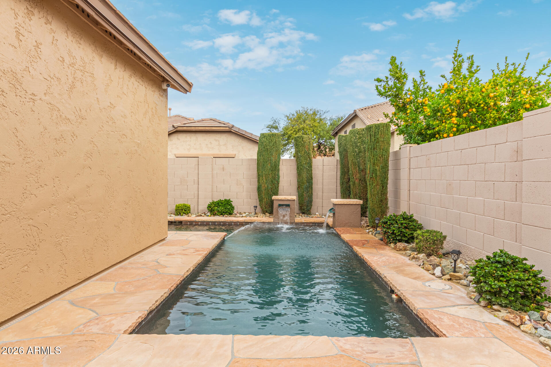 9058 West Redbird Road Peoria, AZ 85383 - Photo 35 of 39 a view of swimming pool with outdoor seating
