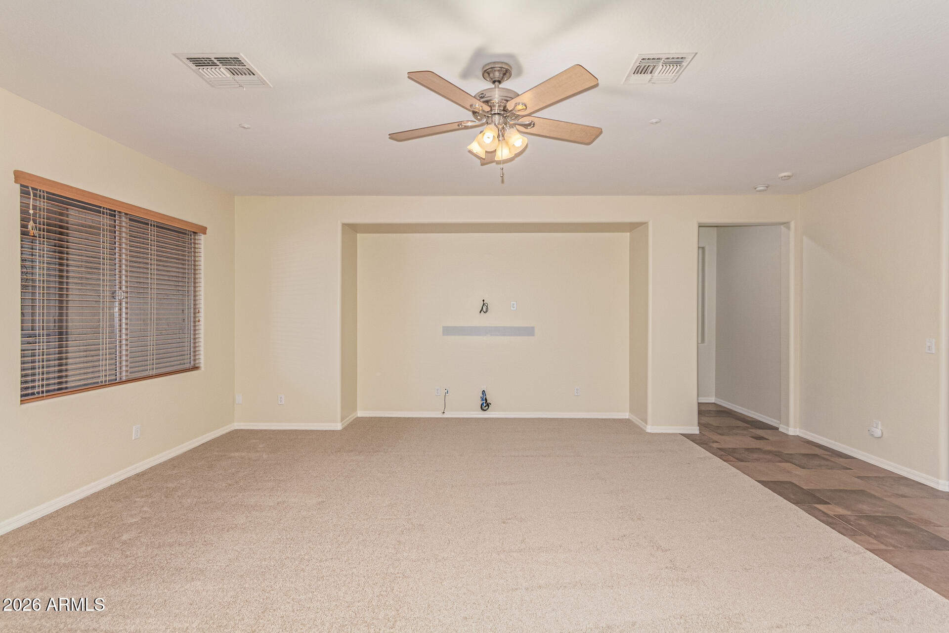 9058 West Redbird Road Peoria, AZ 85383 - Photo 8 of 39 a view of an empty room with a window