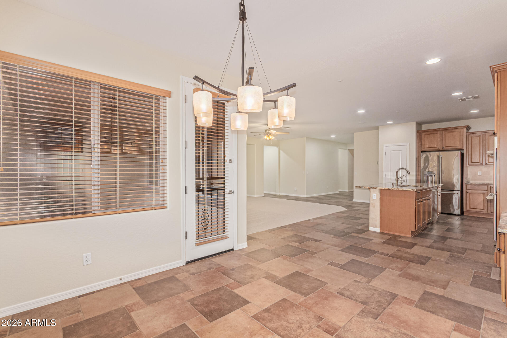 9058 West Redbird Road Peoria, AZ 85383 - Photo 10 of 39 a view of a kitchen with a sink and a window