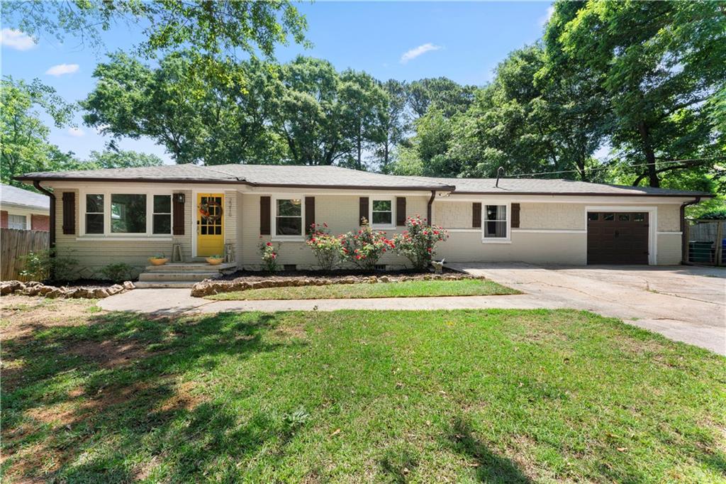 2216 Whites Mill Road Decatur, GA 30032 - Photo 1 of 1 a front view of house with yard and green space