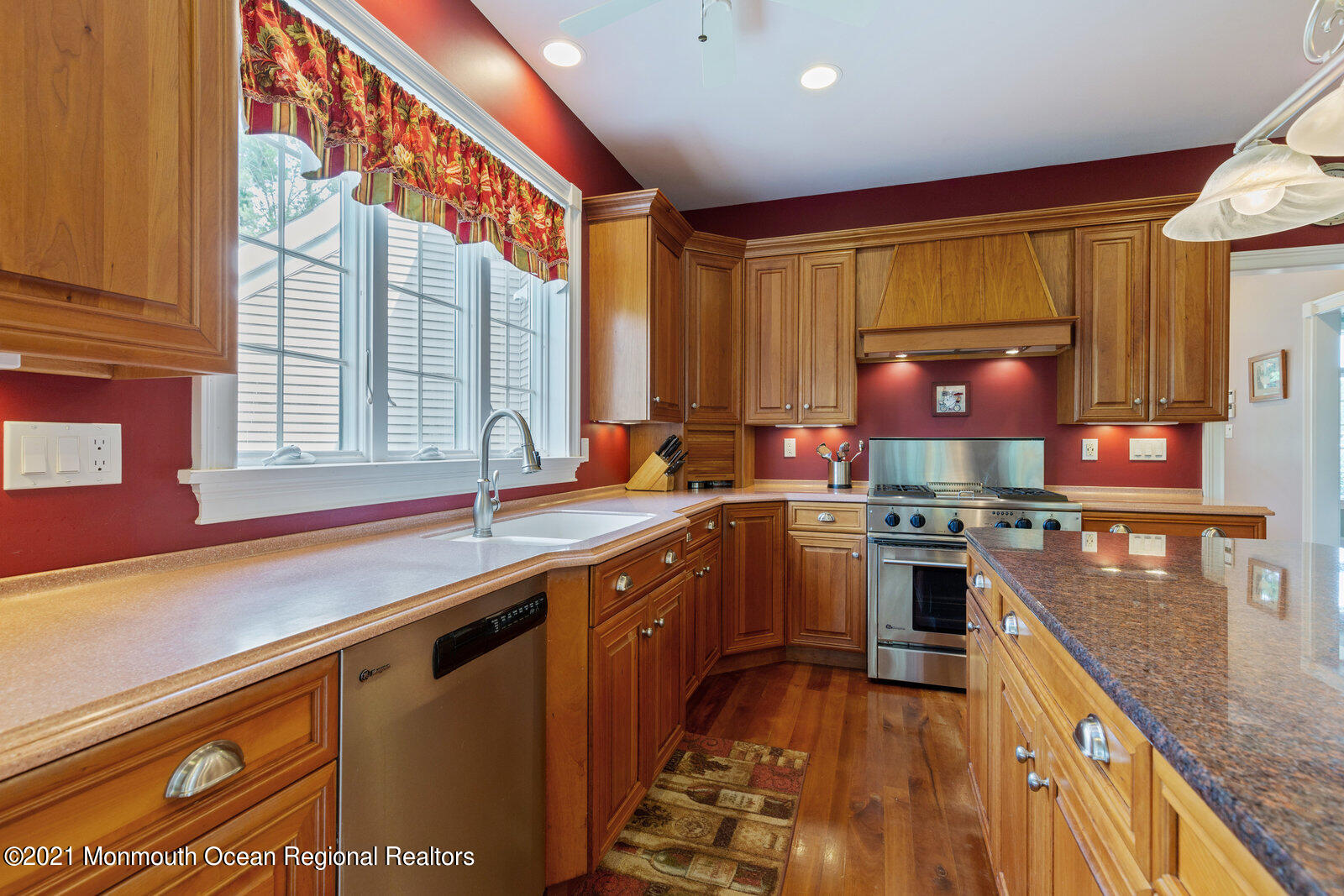 49 Applegate Road Jobstown, NJ 08041 - Photo 14 of 60 a kitchen with stainless steel appliances granite countertop a sink a stove and a wooden cabinets