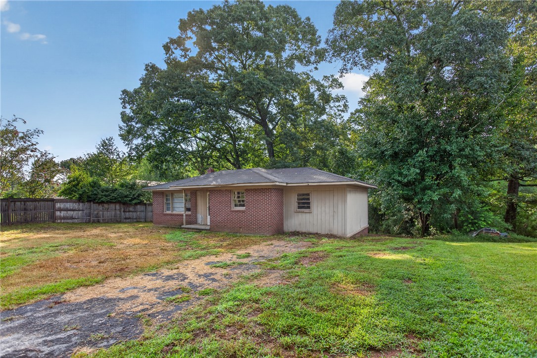 676 Marcengill Road Westminster, SC 29693 - Photo 21 of 32 Mature trees frame a classic single-story brick and siding home with a spacious yard.