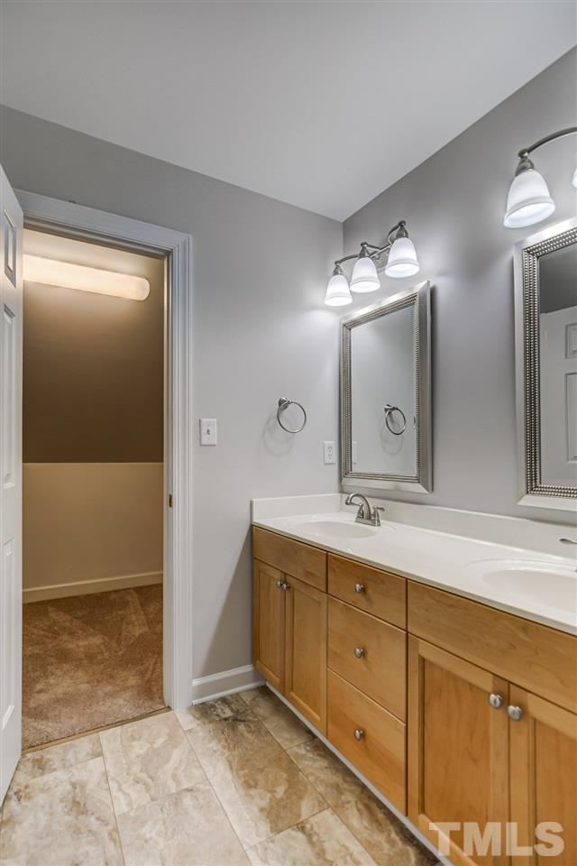10424 Roadstead Way West Raleigh, NC 27613 - Photo 22 of 29 a spacious bathroom with double sink and a mirror