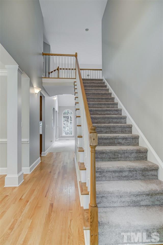 10424 Roadstead Way West Raleigh, NC 27613 - Photo 7 of 29 a view of staircase with white walls and windows