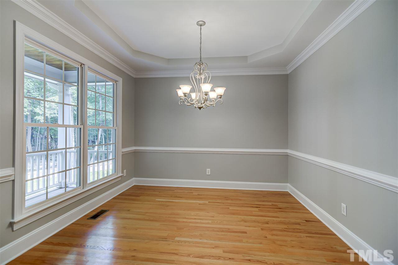10424 Roadstead Way West Raleigh, NC 27613 - Photo 8 of 29 a view of a room with window wooden floor and chandelier