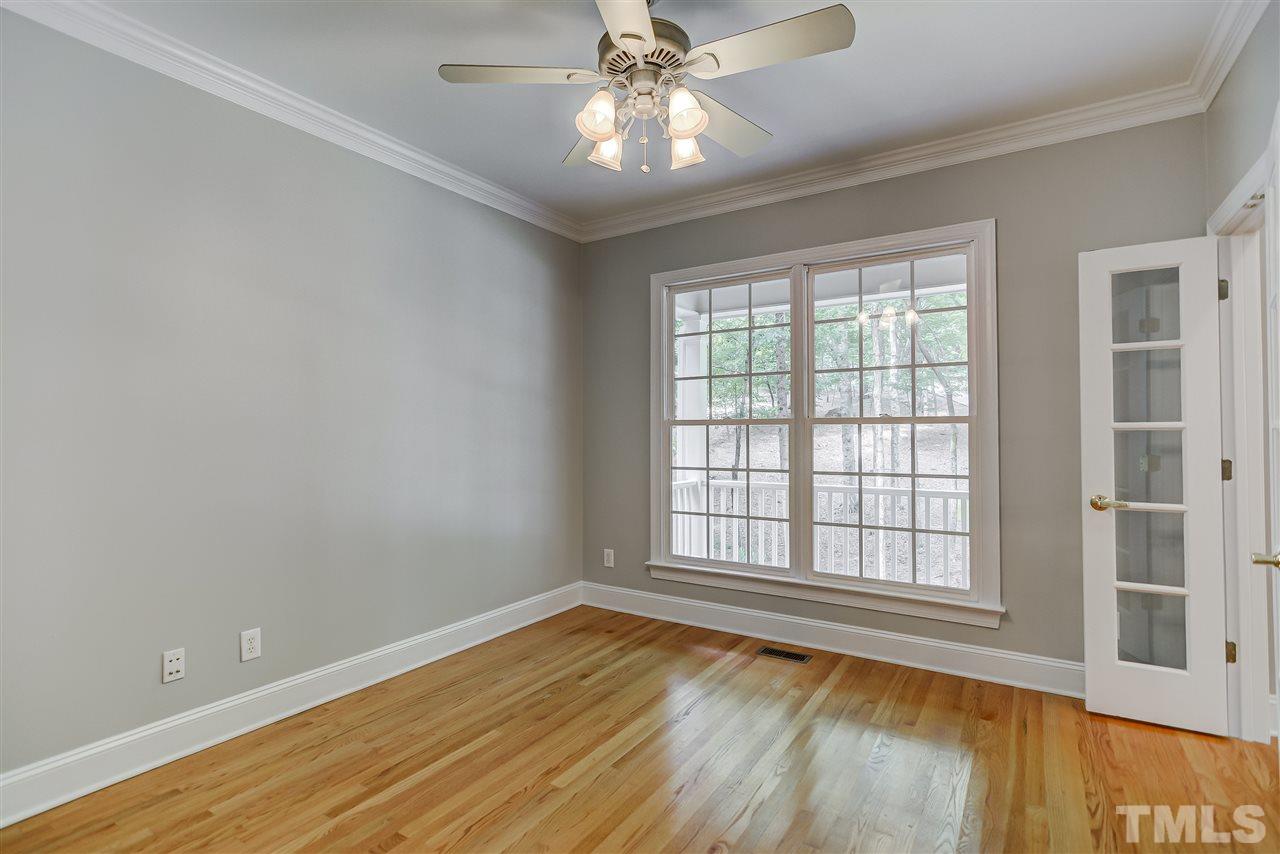 10424 Roadstead Way West Raleigh, NC 27613 - Photo 9 of 29 a view of an empty room with window and wooden floor