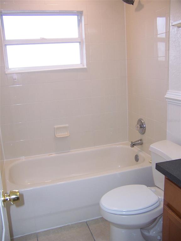 2703 Middle Street Orlando, FL 32807 - Photo 16 of 18 a bathroom with a toilet and a bathtub
