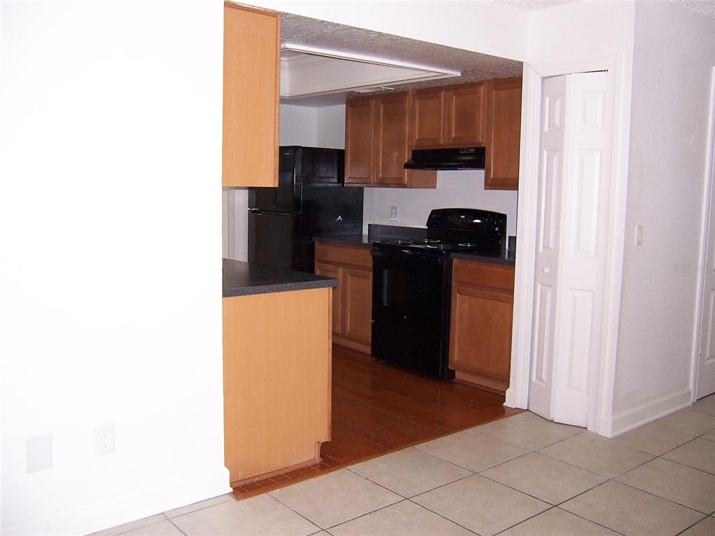 2703 Middle Street Orlando, FL 32807 - Photo 17 of 18 a kitchen with a refrigerator and a stove