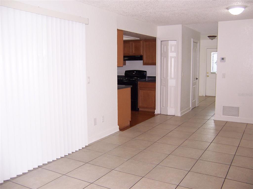 2703 Middle Street Orlando, FL 32807 - Photo 9 of 18 a view of kitchen with furniture and refrigerator