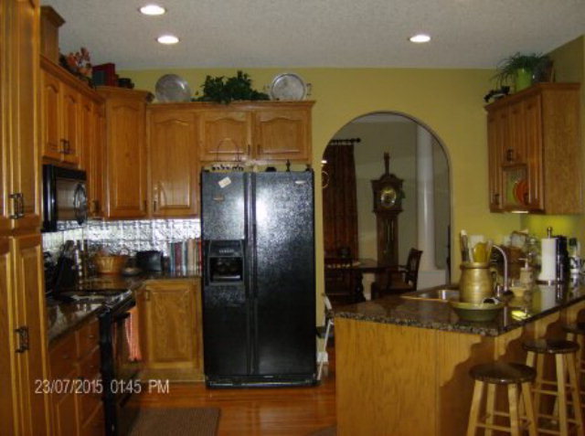130 Riverbend Road Jackson, GA 30233 - Photo 11 of 29 a kitchen with stainless steel appliances granite countertop a refrigerator a stove and a sink