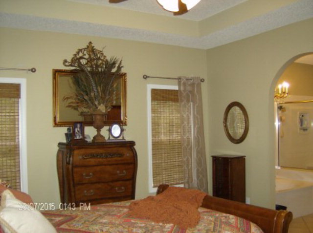 130 Riverbend Road Jackson, GA 30233 - Photo 13 of 29 a bedroom with a bed and a dresser