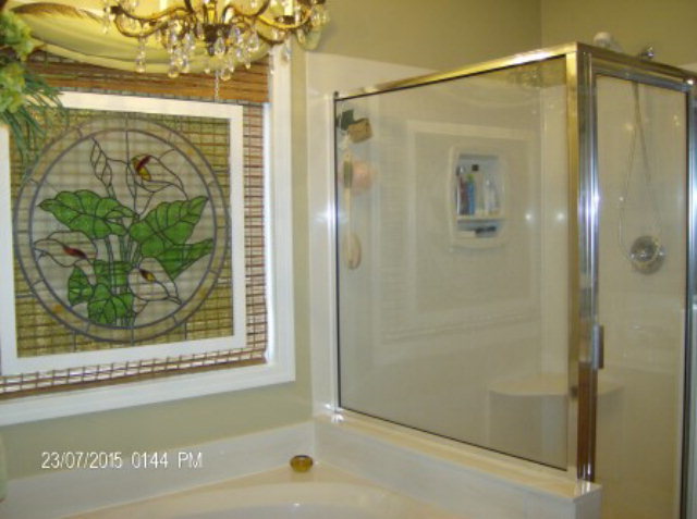 130 Riverbend Road Jackson, GA 30233 - Photo 14 of 29 a bathroom with a shower and a tub