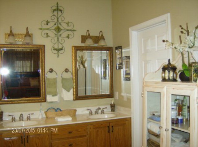 130 Riverbend Road Jackson, GA 30233 - Photo 15 of 29 a bathroom with a granite countertop sink vanity and mirror