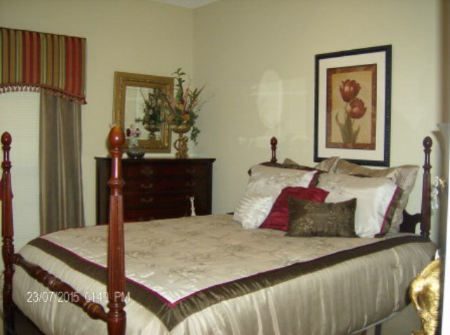130 Riverbend Road Jackson, GA 30233 - Photo 16 of 29 a bedroom with a bed and dresser