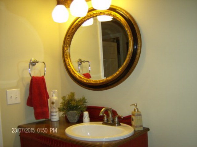 130 Riverbend Road Jackson, GA 30233 - Photo 19 of 29 a bathroom with a toilet and a mirror