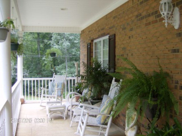 130 Riverbend Road Jackson, GA 30233 - Photo 3 of 29 a view of a chair and table in the balcony