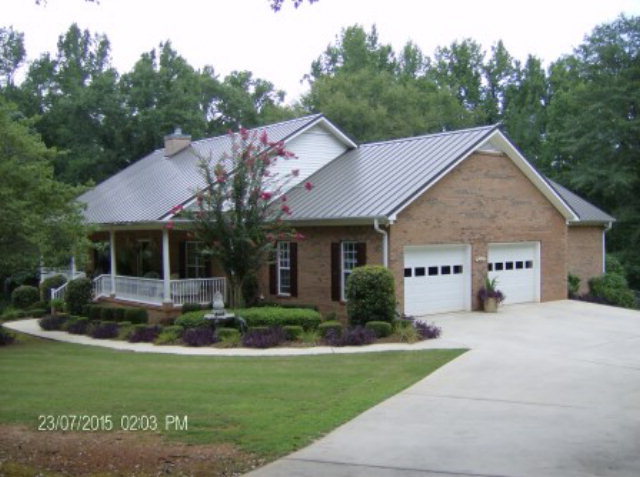 130 Riverbend Road Jackson, GA 30233 - Photo 22 of 29 a house view with a garden space and garden